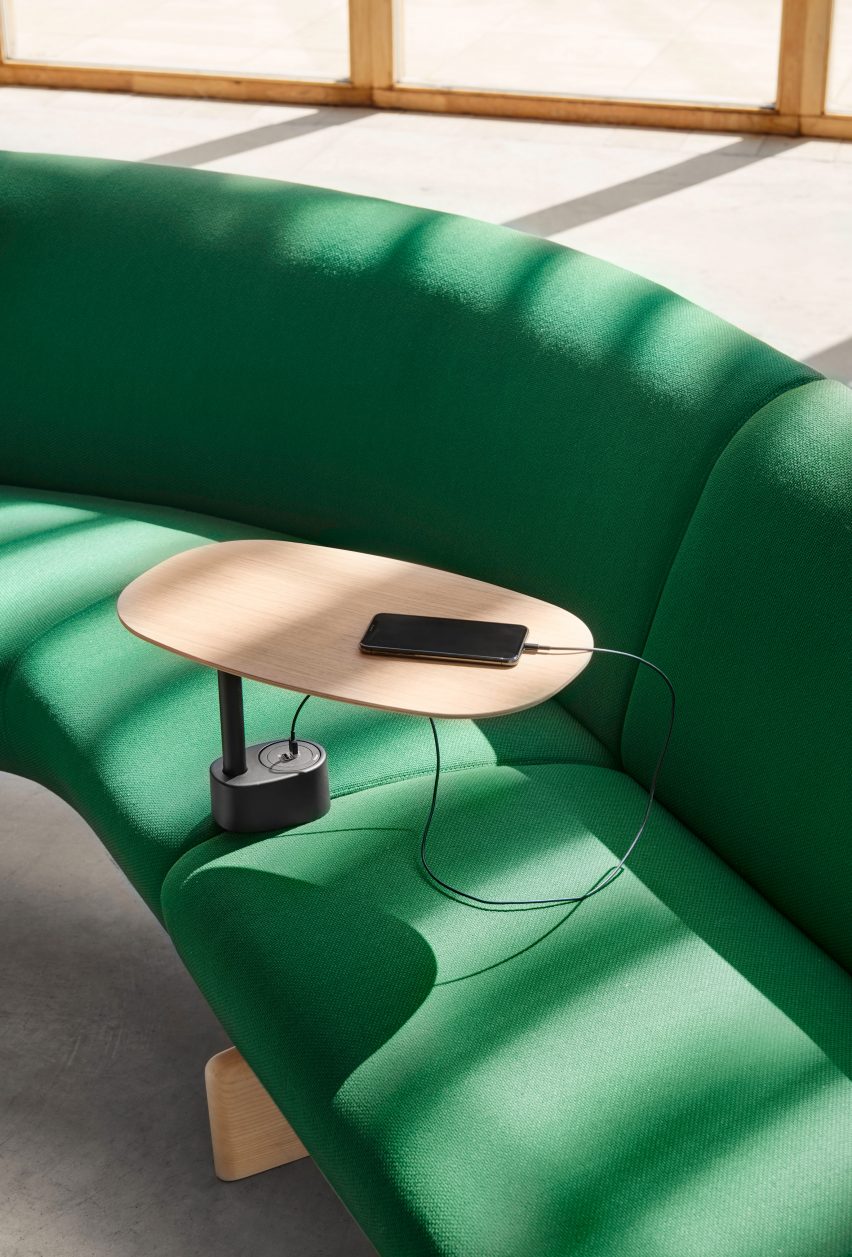 Small wood occasional table attached in between modules of Andreu World sofa