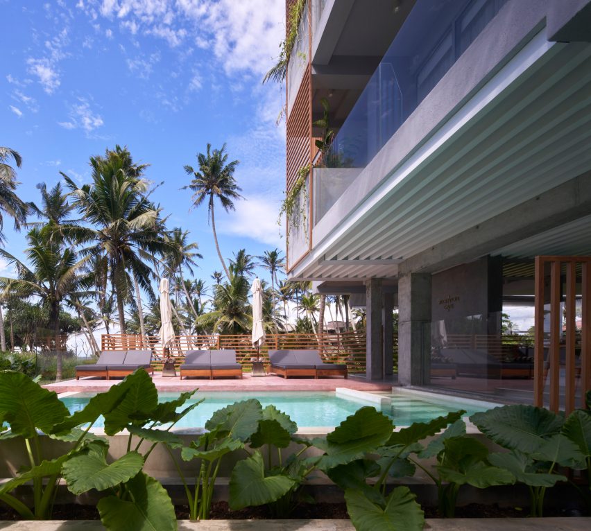 Pool outside a tropical hotel