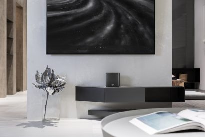 ZenWiFi is pictured on a media cabinet