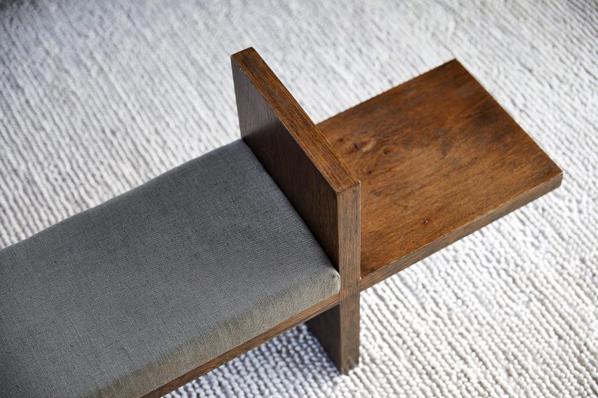 Detail of bench end from above showing upholstered pad and end section