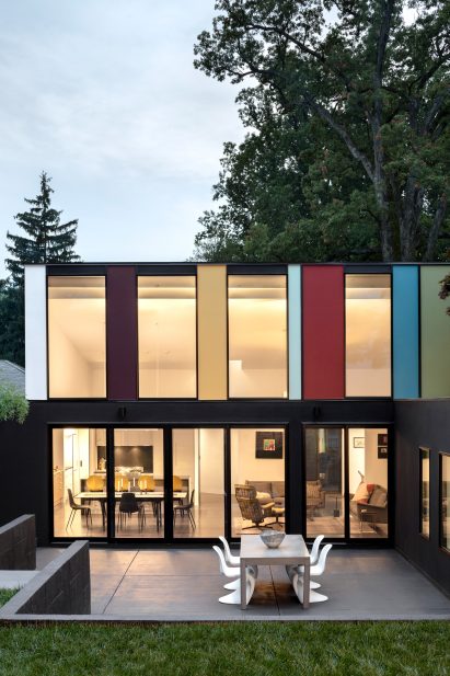 Colourful panels on facade of restored carriage house