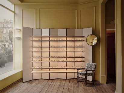 Concertina display stand in front room of eyewear shop designed by Child Studio