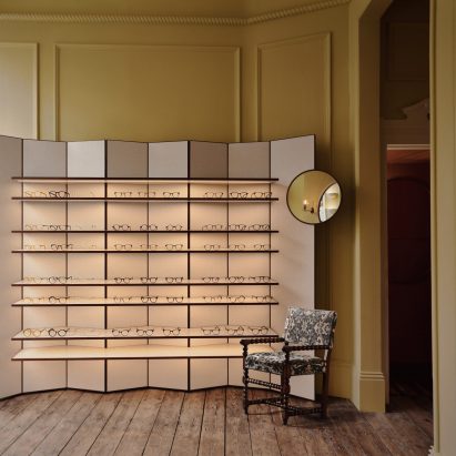 Concertina display stand in front room of Cubitts eyewear shop in Belgravia, London, designed by Child Studio