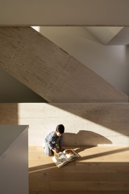 Stairwell with light and child playing