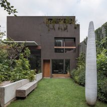 Mexico City renovation by Taller Héctor Barroso includes dark exterior