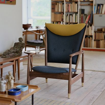 Whisky Chair by Finn Juhl via House of Finn Juhl in a lounge space