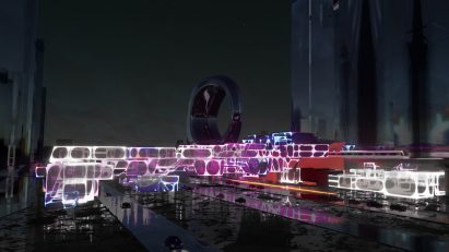 Colourful sprawling building over water at night