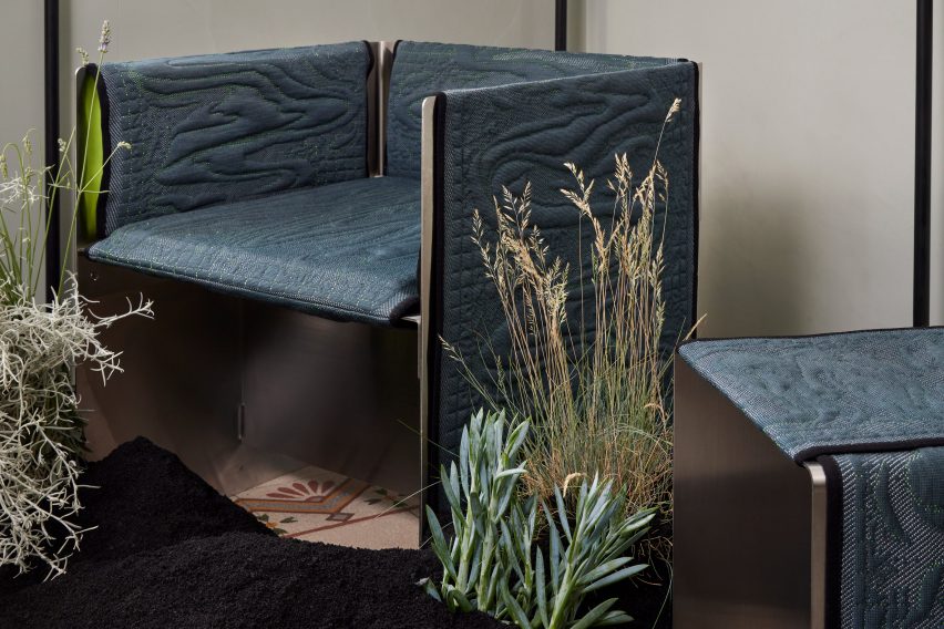 A chair and stool with blue upholstery