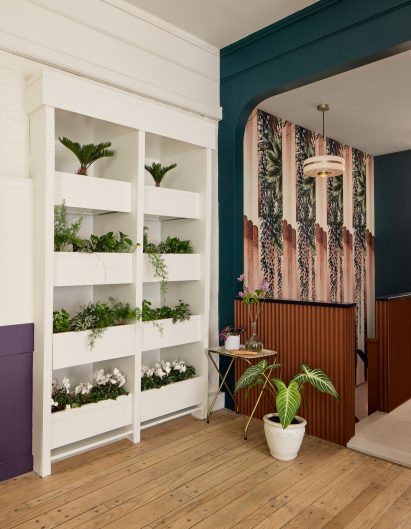 Floral patterns and plants decorate the interior of a Lebanese restaurant by Frederick Tang Architecture