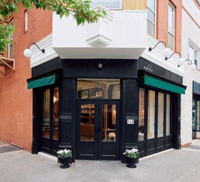 Black and green exterior of corner building in Brooklyn
