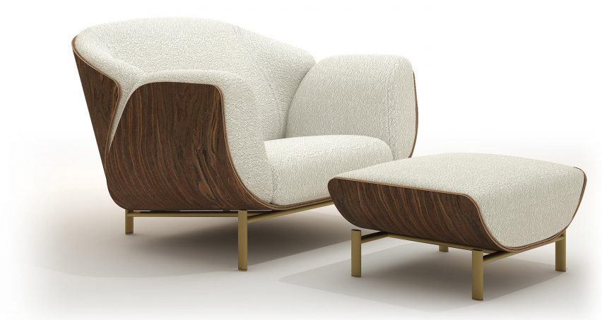 Wooden armchair with cream coloured upholstery and a matching pouf