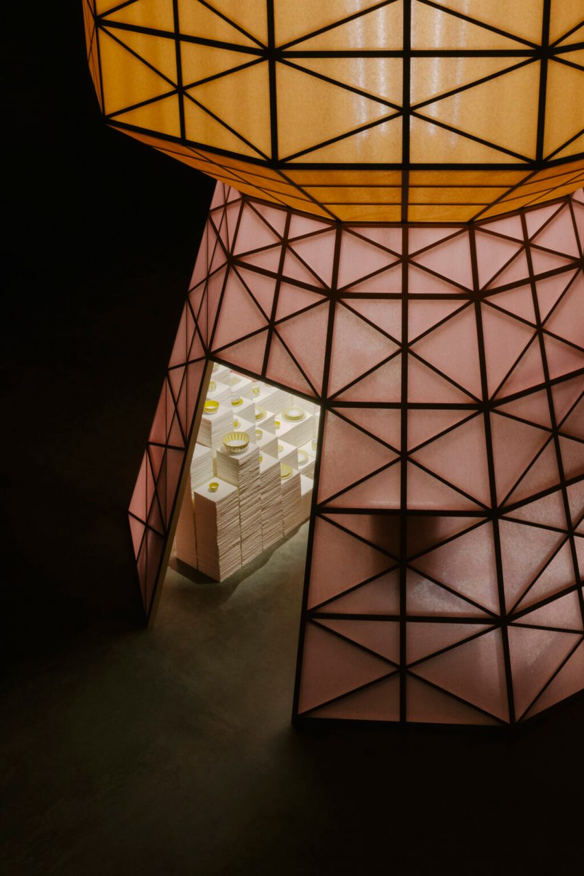 An orange and pink wooden tower