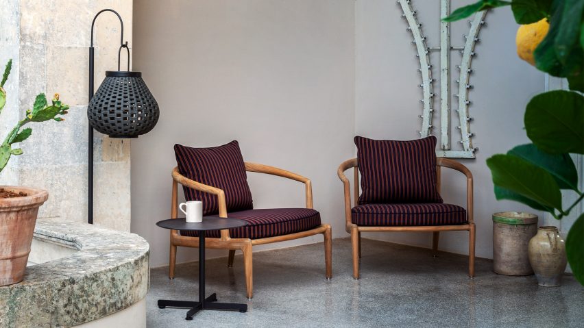 Two Poltrona Frau Secret Garden armchairs on a patio