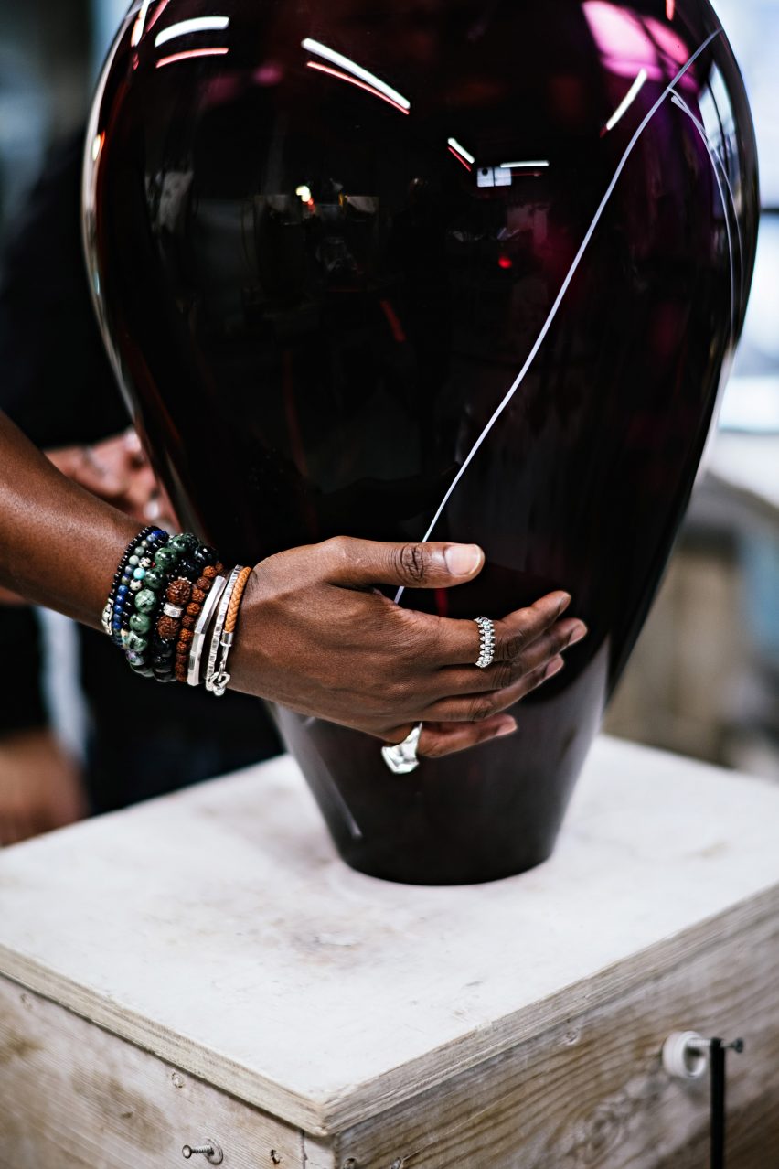 Ini Archibong holding Gaea Pendant