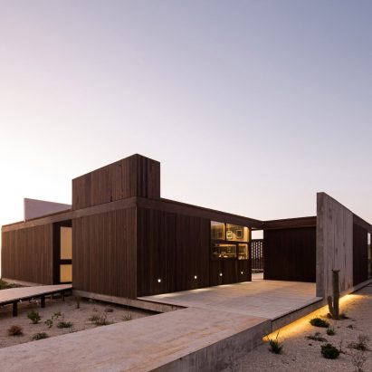 Juan Pablo Ureta orients wooden Chilean beach house around a courtyard