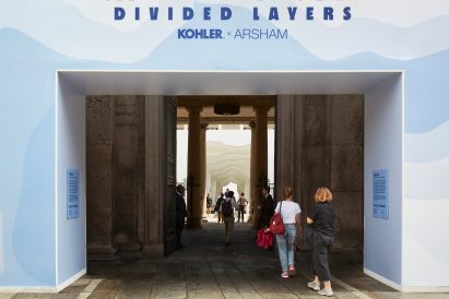 A photograph of people going inside Divided Layers