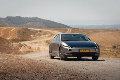 A solar powered car driving through the desert