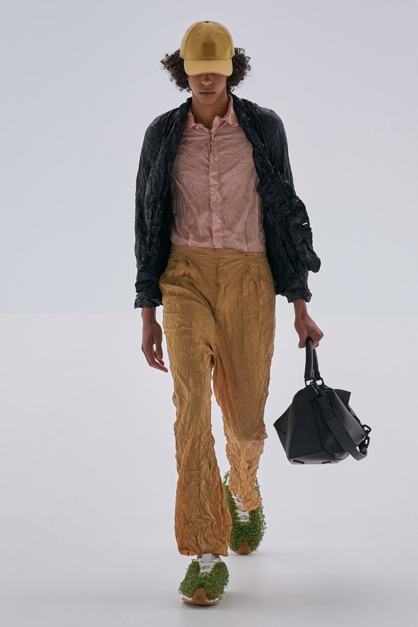Loewe Spring Summer 2023 featured plants growing from shoes and screens fixed to coats