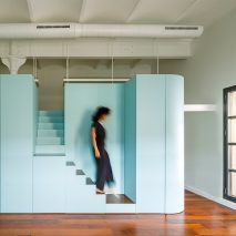 Woman deciding stairs in Loft in Poblenou by Neuronalab