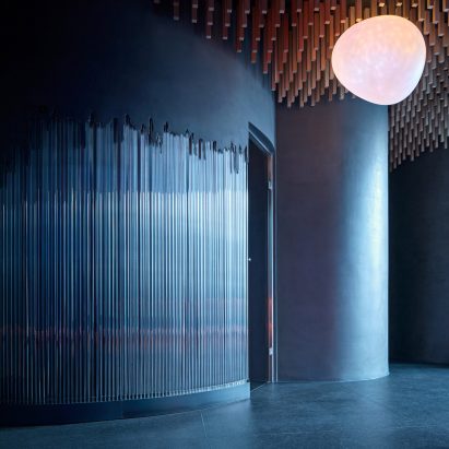 Blue-lit area in spa with ceiling and lighting above
