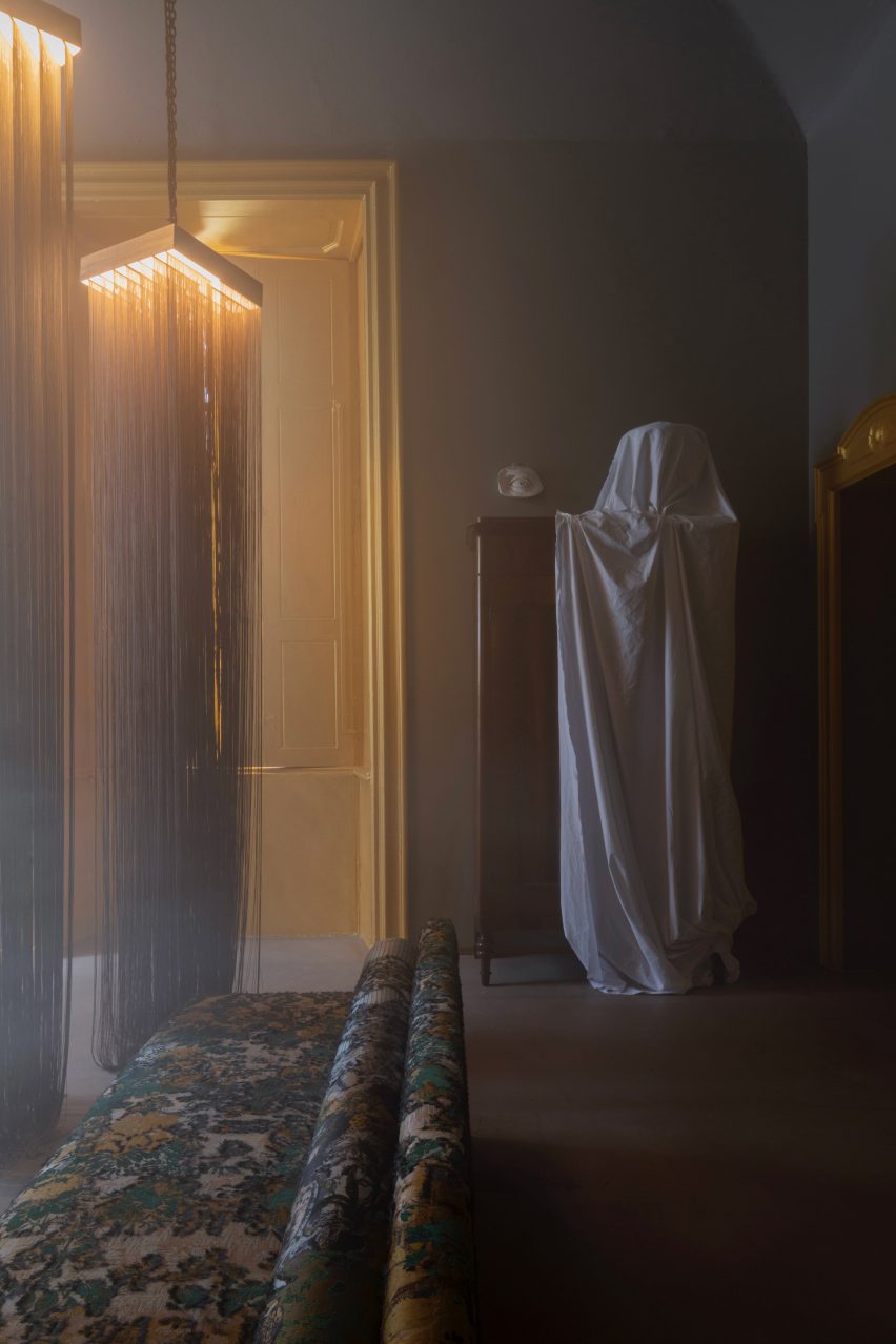 A dusty, smoky room designed by Dimore Studio