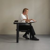 Black Sui Desk Chair used as a desk