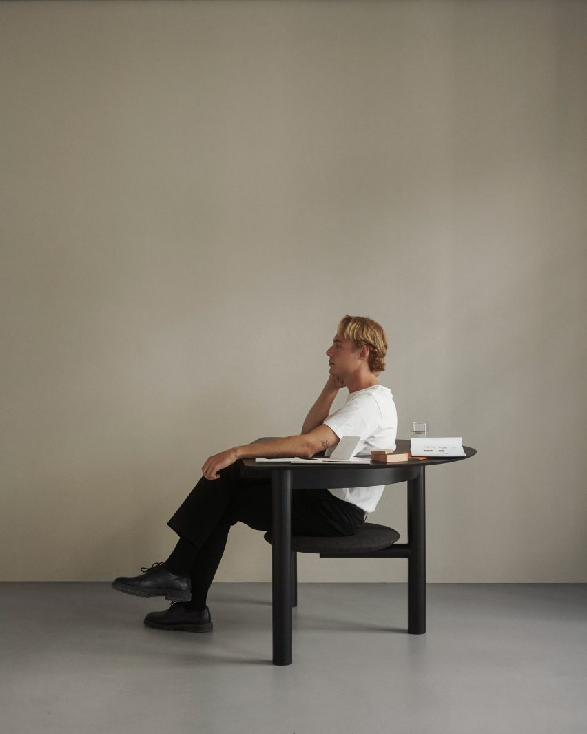 Black Sui Desk Chair used as an armchair