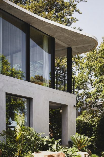 Concrete home in Melbourne with curved roof by Powell and Glenn