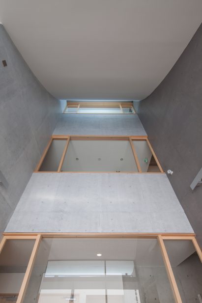 Triple-height atrium of Shinagawa Branch Temple by Abanba