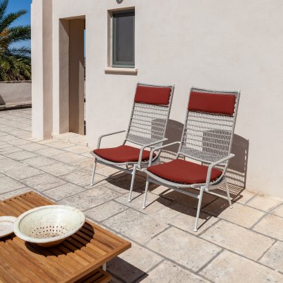 Two Solaria high armchair by Ludovica + Roberto Palomba for Poltrona Frau outside