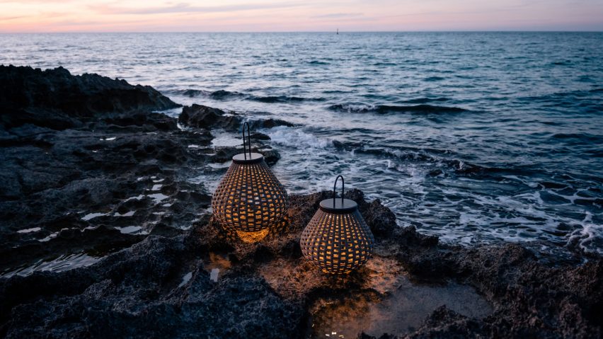 Two lamps on rocks by the sea