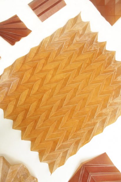 Naturally dyed folded material samples by Studio Lionne van Deursen