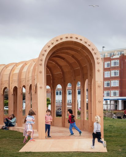 Children playing at an entrance into The Riwaq