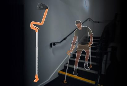 Man walking downstairs using student-designed mobility aid
