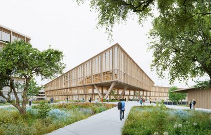 Timber building with large glass windows supported by V-shaped angled columns