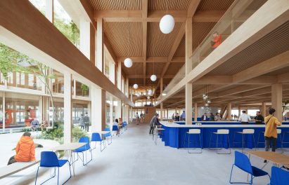 Multiple levels in timber building with seating and floor-to-ceiling windows