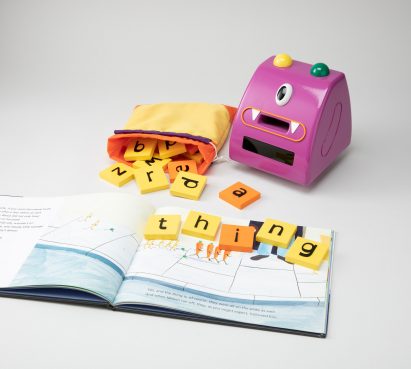 Purple monster toy that speaks phonetically through a speaker