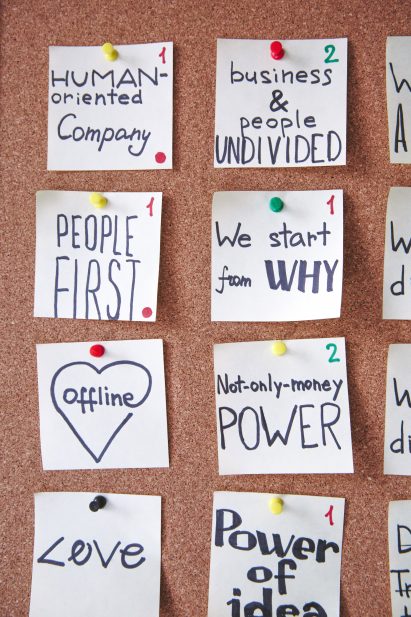 Notes displayed on a cork board