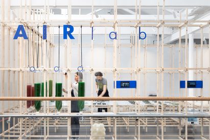 Two people working in an air purifying lab