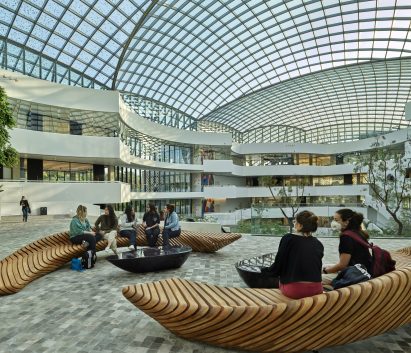 People sitting on wooden benches