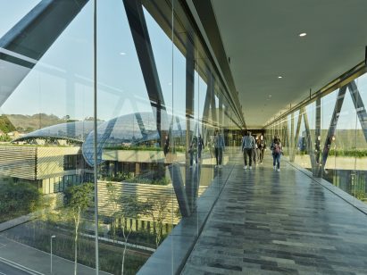 Glass walkway with centre in the background