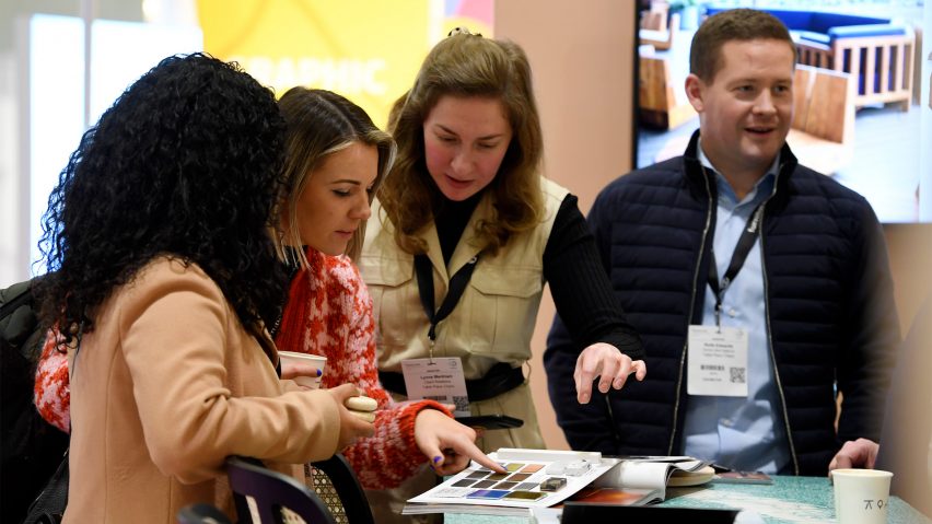 People looking at a book of samples