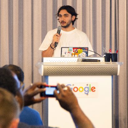 A photograph of a person doing a talk