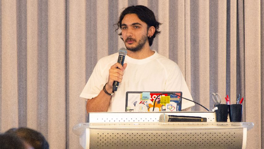 A photograph of a person doing a talk