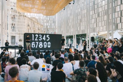 People listening to a talk in the pavilion