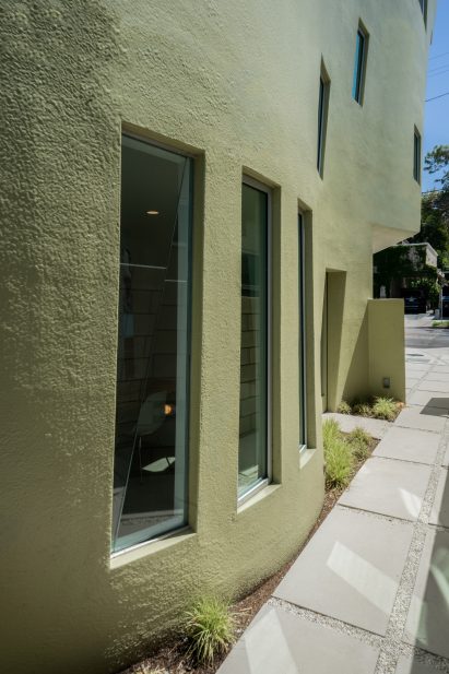 Roughly textured curved yellow walls of house in southern California