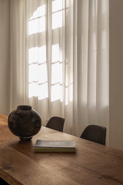 A table in front of a white curtain