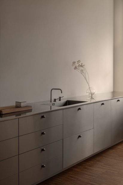 A metal kitchen sick and counter