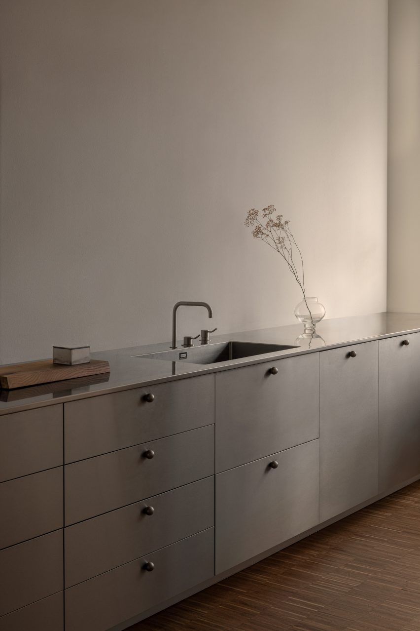 A metal kitchen sick and counter
