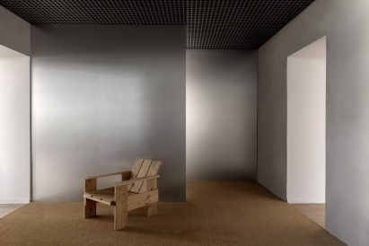 A wooden chair in a hallway